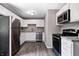 Updated kitchen featuring white cabinets, stainless steel appliances, and granite countertops at 3617 Woodcliff Dr, Indianapolis, IN 46203
