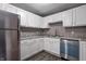 Updated kitchen featuring white cabinets, stainless steel appliances, and granite countertops at 3617 Woodcliff Dr, Indianapolis, IN 46203