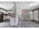 Open kitchen with white cabinets flows into the living area, perfect for entertaining at 3617 Woodcliff Dr, Indianapolis, IN 46203