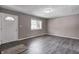 Bright living room with hardwood floors, fresh paint, and natural light at 3617 Woodcliff Dr, Indianapolis, IN 46203