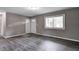Bright living room with hardwood floors, fresh paint, and natural light at 3617 Woodcliff Dr, Indianapolis, IN 46203