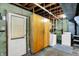 Unfinished basement featuring laundry area, ample storage and access to the backyard at 3663 Kline N Dr, Indianapolis, IN 46226