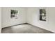 Bedroom with neutral carpet and views of the outdoors through two windows at 3663 Kline N Dr, Indianapolis, IN 46226