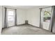 Sunlit bedroom featuring neutral carpet, two large windows, and gray curtains at 3663 Kline N Dr, Indianapolis, IN 46226