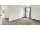 Bedroom with neutral carpet, window with gray curtains, and closet at 3663 Kline N Dr, Indianapolis, IN 46226