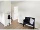 Bright entryway features wood floors, neutral walls, a decorative accent table and a hall bench at 3663 Kline N Dr, Indianapolis, IN 46226