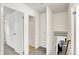 Bright upstairs hallway features neutral carpet, closet, and access to bathroom and stairs at 3663 Kline N Dr, Indianapolis, IN 46226
