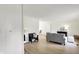 Open-concept living room with modern furnishings, neutral walls, and wood flooring at 3663 Kline N Dr, Indianapolis, IN 46226