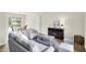Inviting living room with modern furnishings, neutral walls, and seamless flow to the dining area at 3663 Kline N Dr, Indianapolis, IN 46226