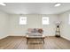 Spacious living area with hardwood floors, sofa, and lighting at 3663 Kline N Dr, Indianapolis, IN 46226
