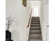 Carpeted stairway with wooden handrail at 3663 Kline N Dr, Indianapolis, IN 46226