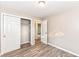 Updated bedroom with wood floors, light gray paint, and an accessible closet at 3938 N Grand Ave, Indianapolis, IN 46226
