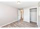This neutral bedroom offers updated wood floors and an easily accessible closet at 3938 N Grand Ave, Indianapolis, IN 46226