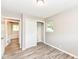 This bedroom features modern wood floors, a closet, and neutral paint throughout at 3938 N Grand Ave, Indianapolis, IN 46226