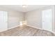 Bedroom featuring wood-look flooring, neutral walls, and closet doors at 3938 N Grand Ave, Indianapolis, IN 46226