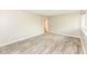 Bright living room featuring neutral walls, wood-look floors, and natural light from a window at 3938 N Grand Ave, Indianapolis, IN 46226