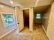 Bedroom with carpeting, two windows, and closet in the corner at 405 N Bradley Ave, Indianapolis, IN 46201