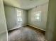 Cozy bedroom with neutral paint and carpet, perfect for relaxation and personalization at 405 N Bradley Ave, Indianapolis, IN 46201