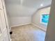 Cozy bedroom with plush carpeting and natural light from the window at 405 N Bradley Ave, Indianapolis, IN 46201