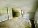 Bedroom featuring vaulted ceiling, carpeted floor, and natural light from window at 405 N Bradley Ave, Indianapolis, IN 46201