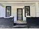 Charming front porch with black and white detailing at 405 N Bradley Ave, Indianapolis, IN 46201