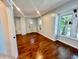 Inviting open space showcasing hardwood floors and abundant natural light creating a warm ambiance at 405 N Bradley Ave, Indianapolis, IN 46201