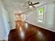 Open-concept living room with gleaming hardwood floors and natural light, ideal for entertaining at 405 N Bradley Ave, Indianapolis, IN 46201