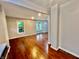 Inviting living room featuring hardwood floors and natural light from the windows at 405 N Bradley Ave, Indianapolis, IN 46201