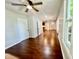 Spacious living room featuring gleaming hardwood floors, offering versatile living at 405 N Bradley Ave, Indianapolis, IN 46201