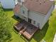 Aerial view showcasing the back deck and lush green yard of the property at 4533 Golden Meadow Dr, Indianapolis, IN 46254