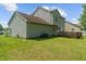Backyard featuring a two-story home with siding and a wooden deck at 4533 Golden Meadow Dr, Indianapolis, IN 46254