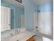 Bathroom featuring a tub, toilet, and sink with vanity, all in shades of blue and white at 4533 Golden Meadow Dr, Indianapolis, IN 46254