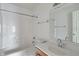 Bright bathroom featuring a shower-tub combo and a single-sink vanity at 4533 Golden Meadow Dr, Indianapolis, IN 46254