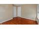 Bedroom featuring hardwood flooring, two closets, and a bright window at 4533 Golden Meadow Dr, Indianapolis, IN 46254