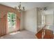 Formal dining room with large window and elegant chandelier at 4533 Golden Meadow Dr, Indianapolis, IN 46254