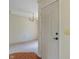 A bright entryway featuring a chandelier and neutral paint that leads to an open living space at 4533 Golden Meadow Dr, Indianapolis, IN 46254