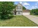 Charming two-story home featuring a well-maintained lawn, attached garage, and classic siding at 4533 Golden Meadow Dr, Indianapolis, IN 46254