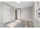 Clean bedroom with gray walls, hard surface floors, and access to two closets at 4749 W Smith Valley Rd, Greenwood, IN 46142