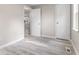 Neutrally painted room with hard surface flooring, featuring closet and overhead lighting at 4749 W Smith Valley Rd, Greenwood, IN 46142