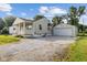 This home has a long gravel driveway leading to a detached garage and backyard at 4749 W Smith Valley Rd, Greenwood, IN 46142