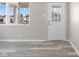 Bright entryway with stylish vinyl floors, decorative front door and ample natural light at 4749 W Smith Valley Rd, Greenwood, IN 46142