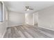 Spacious, naturally lit living room featuring light vinyl floors and neutral walls at 4749 W Smith Valley Rd, Greenwood, IN 46142