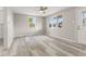 Bright living room features a ceiling fan and vinyl floors at 4749 W Smith Valley Rd, Greenwood, IN 46142