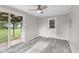 Cozy sun room with sliding glass door access to the covered patio and backyard at 4749 W Smith Valley Rd, Greenwood, IN 46142