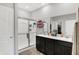 This spacious bathroom features a double sink vanity and a glass-enclosed shower at 5120 Woodhurst Ln, Indianapolis, IN 46239