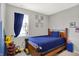 Bedroom features a cozy bed, window view, and whimsical decorations at 5120 Woodhurst Ln, Indianapolis, IN 46239