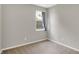 This bedroom has neutral walls with a window and great natural light at 5120 Woodhurst Ln, Indianapolis, IN 46239