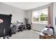 Bedroom space featuring workout equipment, a vanity table with mirror, and natural light from the window at 5120 Woodhurst Ln, Indianapolis, IN 46239