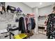 Organized walk-in closet with shelves, hanging clothes, and storage bins at 5120 Woodhurst Ln, Indianapolis, IN 46239