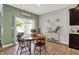 Dining area with a wood table, chairs, sliding door and neutral decor at 5120 Woodhurst Ln, Indianapolis, IN 46239